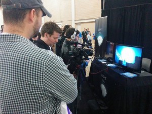 Table cloth and media roller next to Destin and Vince from IGN